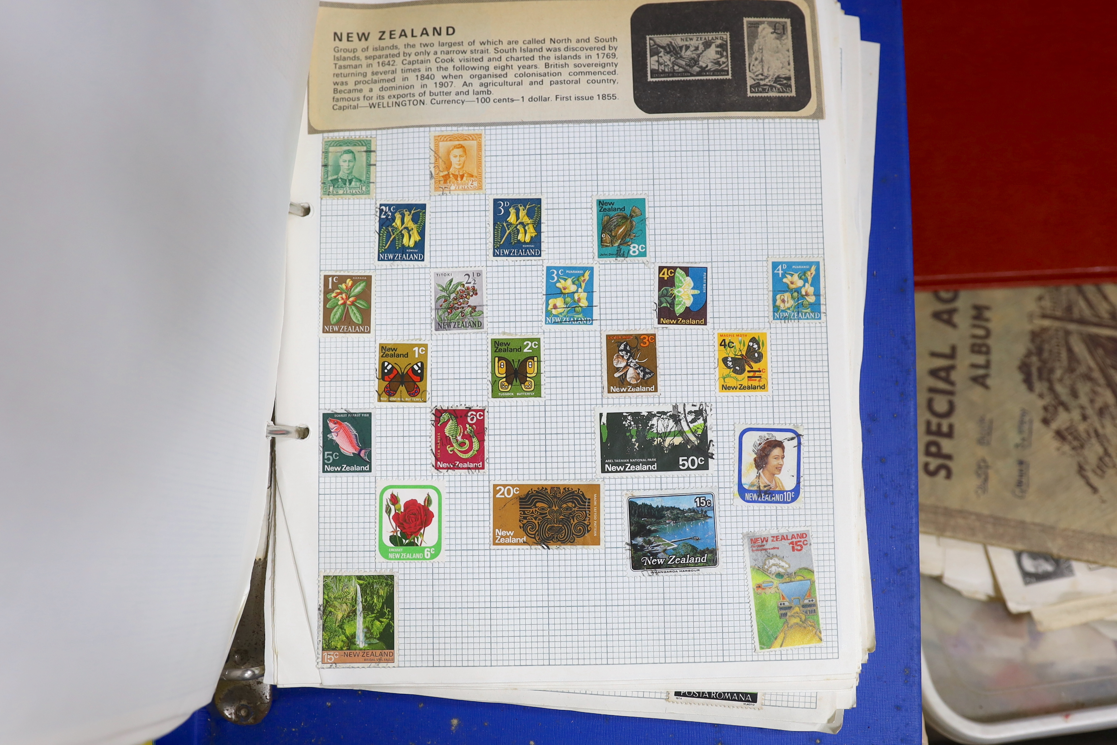 A collection of world stamps, some arranged in albums